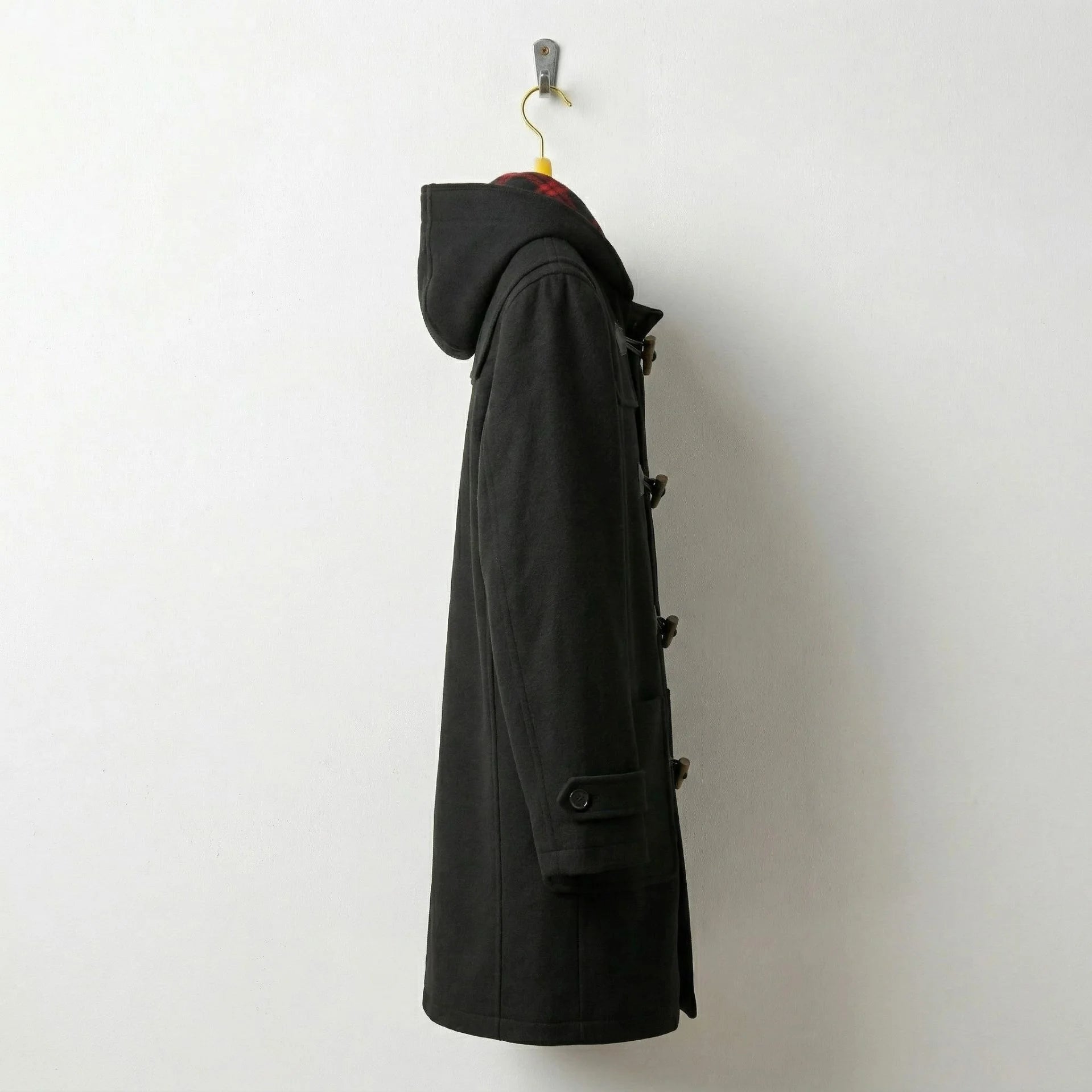 Side profile of men's black hooded duffle wool coat with regular fit.