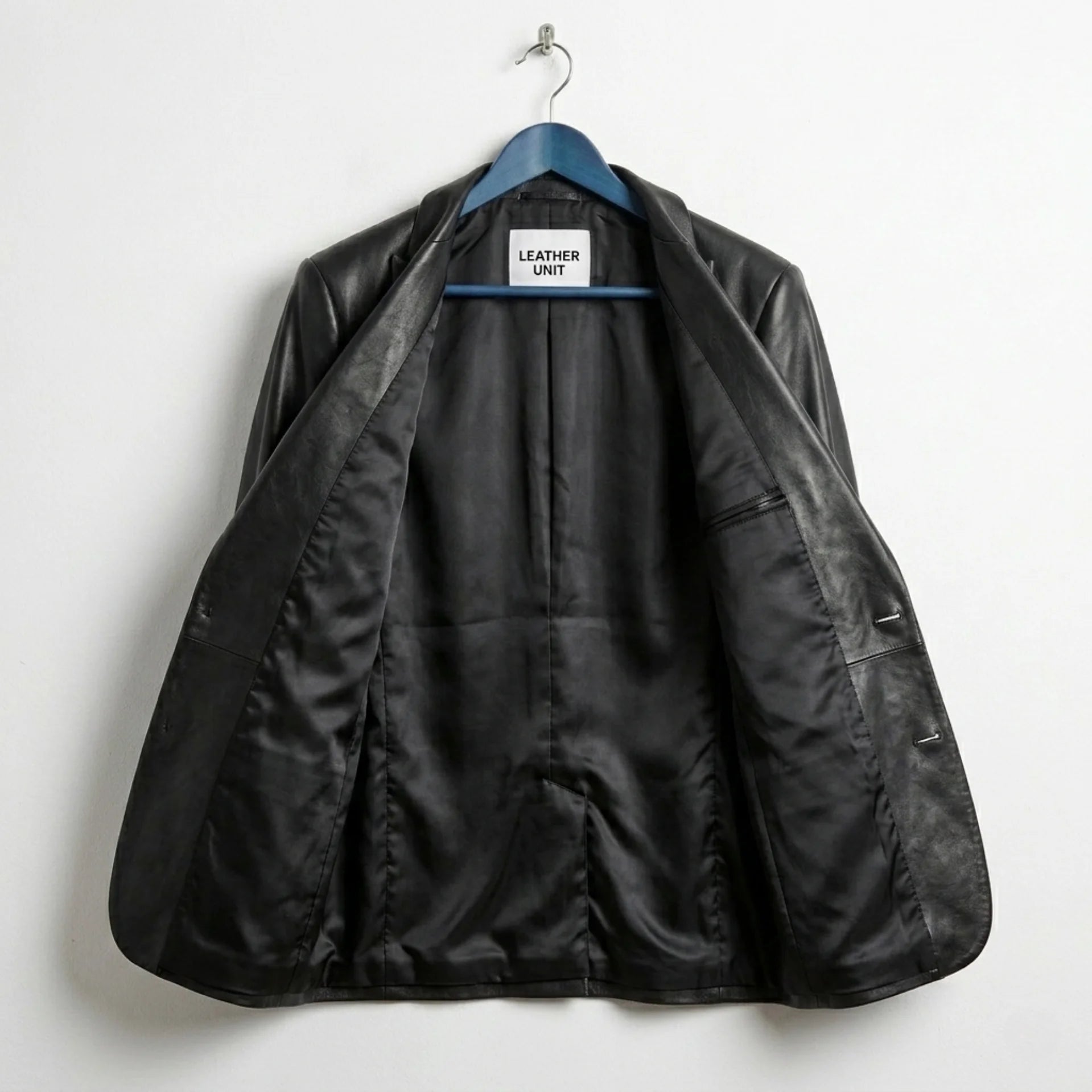 Inside lining of men’s black lamb leather blazer showing inner pockets