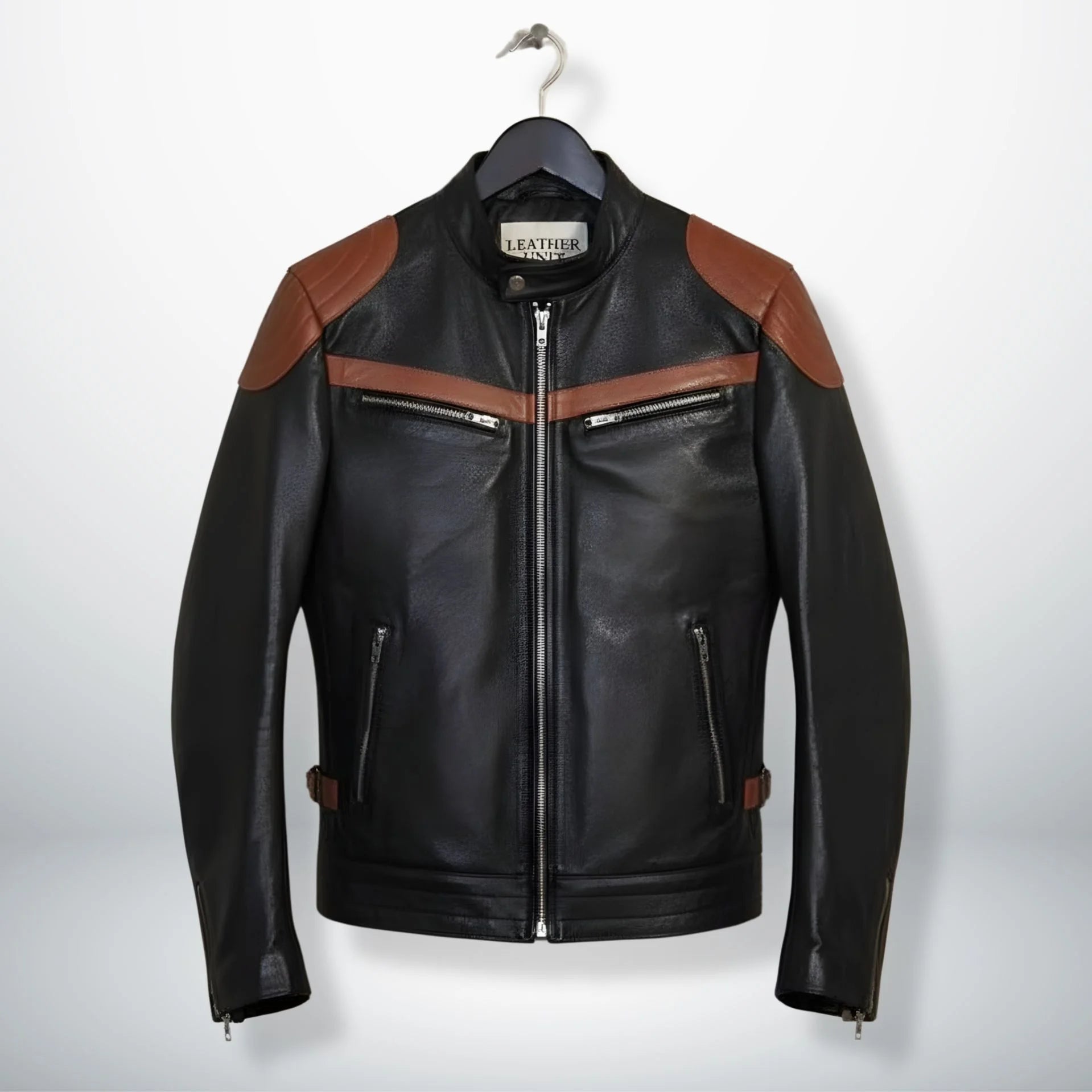 front view of men's black leather biker jacket with brown stripes and zip pockets.