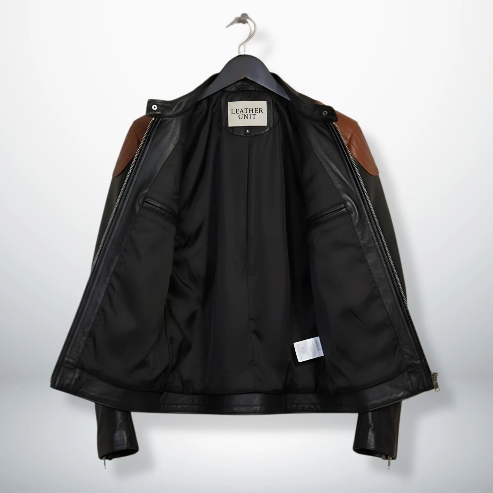 inside view of men's black leather moto jacket showing smooth black lining and inner pockets.