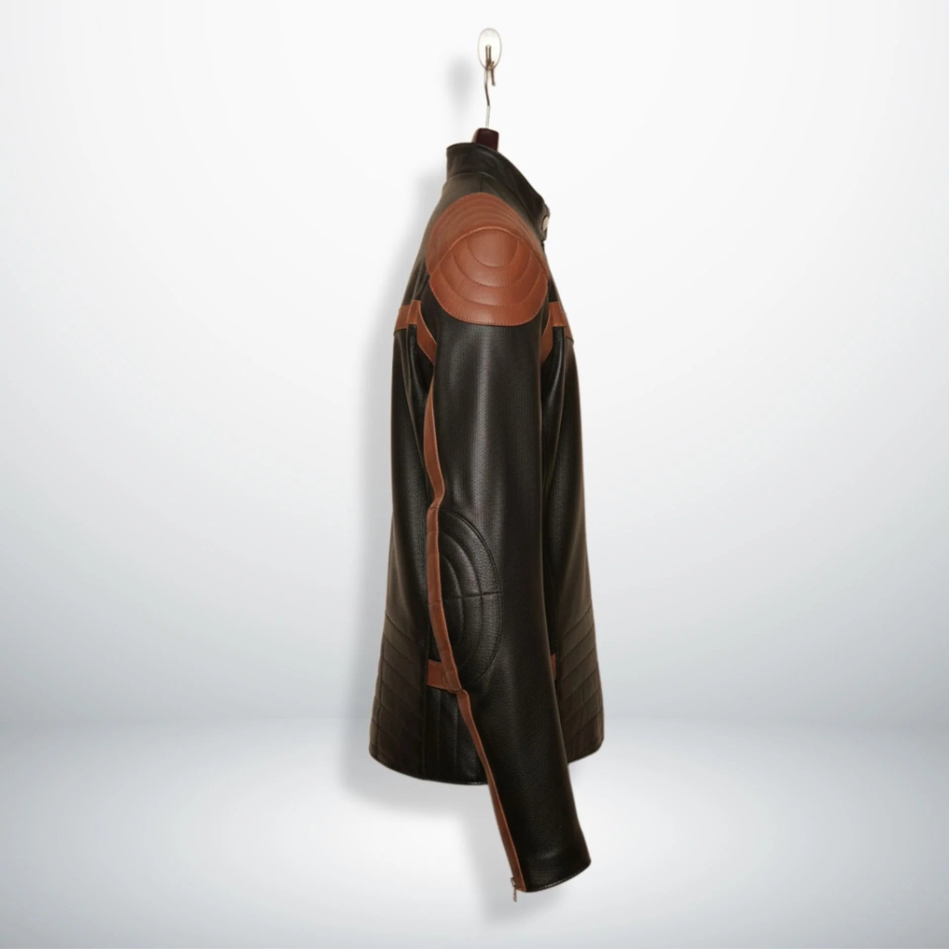 side profile of men's black leather biker jacket with brown stripe sleeves and padded elbows.