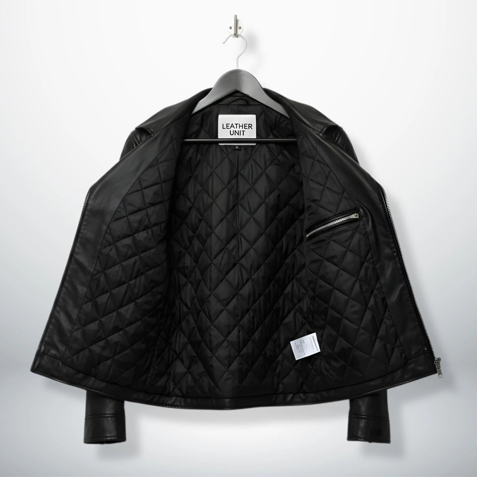 interior of men's black leather biker jacket showing diamond quilted lining.