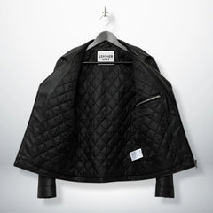interior of men's black leather biker jacket showing diamond quilted lining.