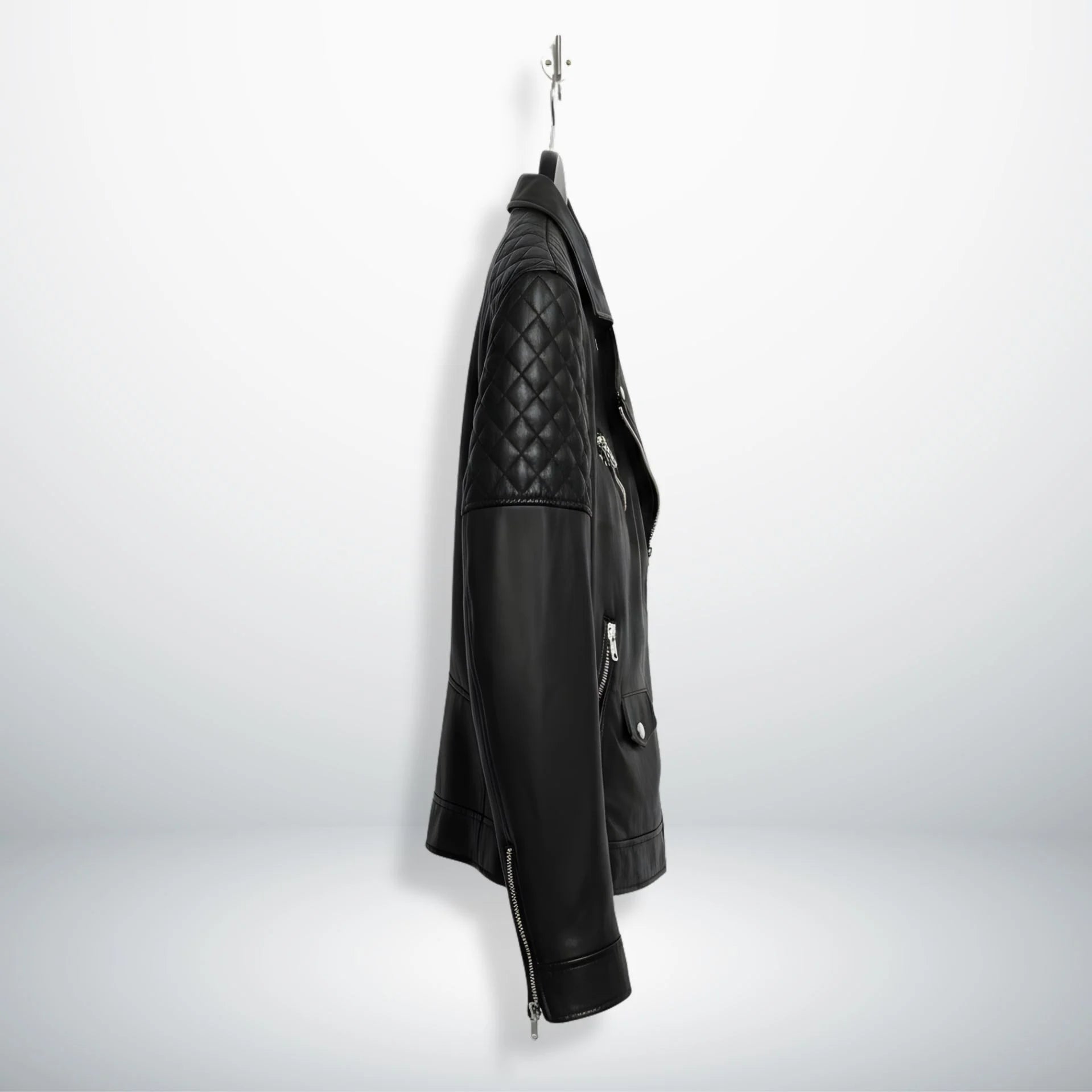 side profile of men's slim black leather moto jacket with quilted arm.