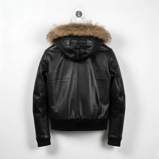 back view of men's black leather hooded bomber jacket with fur trim.