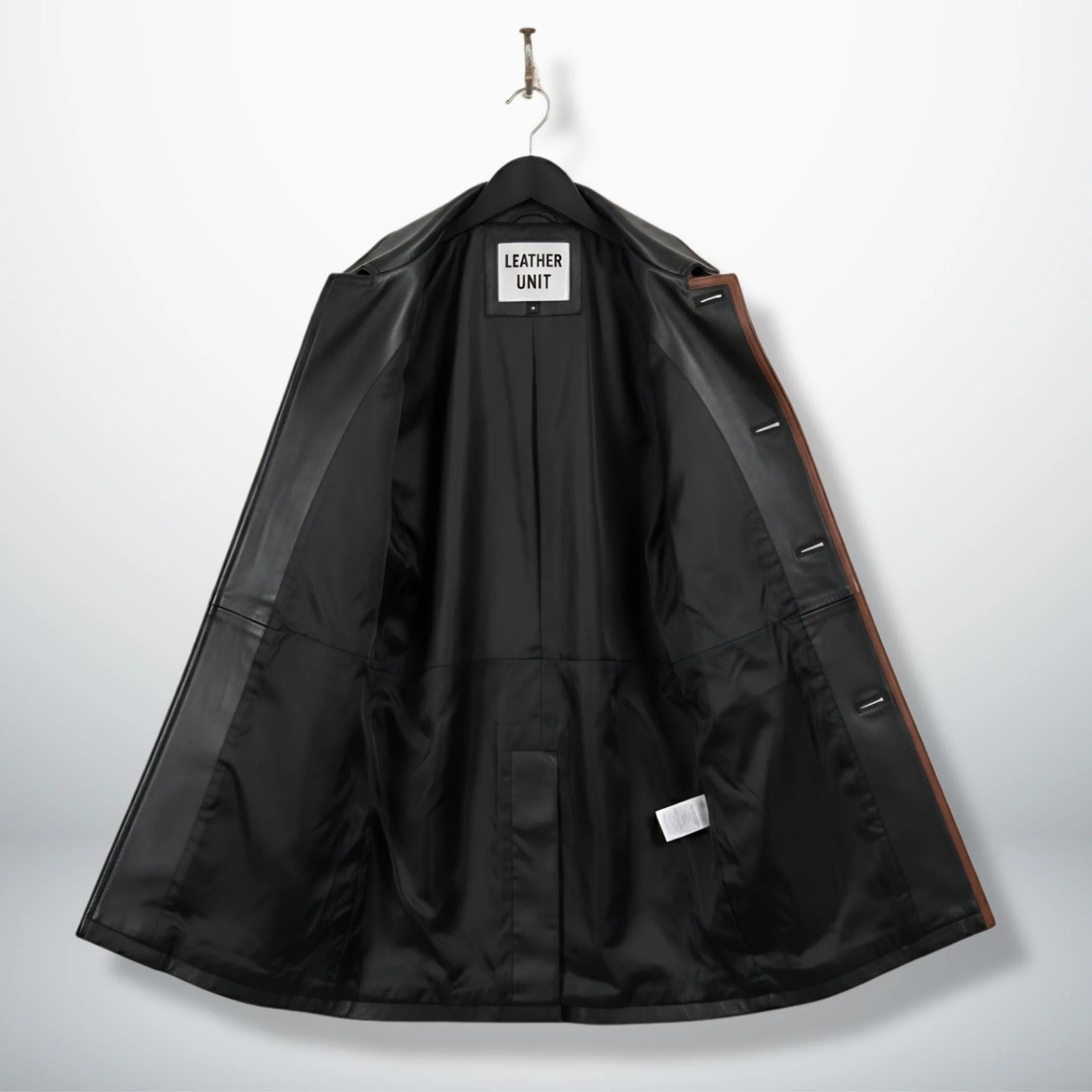 Inside lining of men’s black leather car coat showing interior pockets