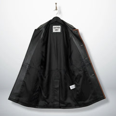 Inside lining of men’s black leather car coat showing interior pockets