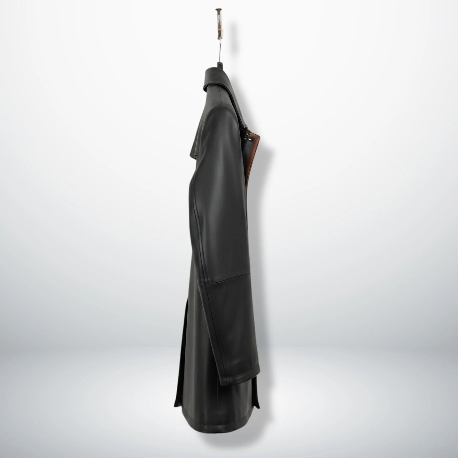 Side profile of men’s black 3/4 leather car coat