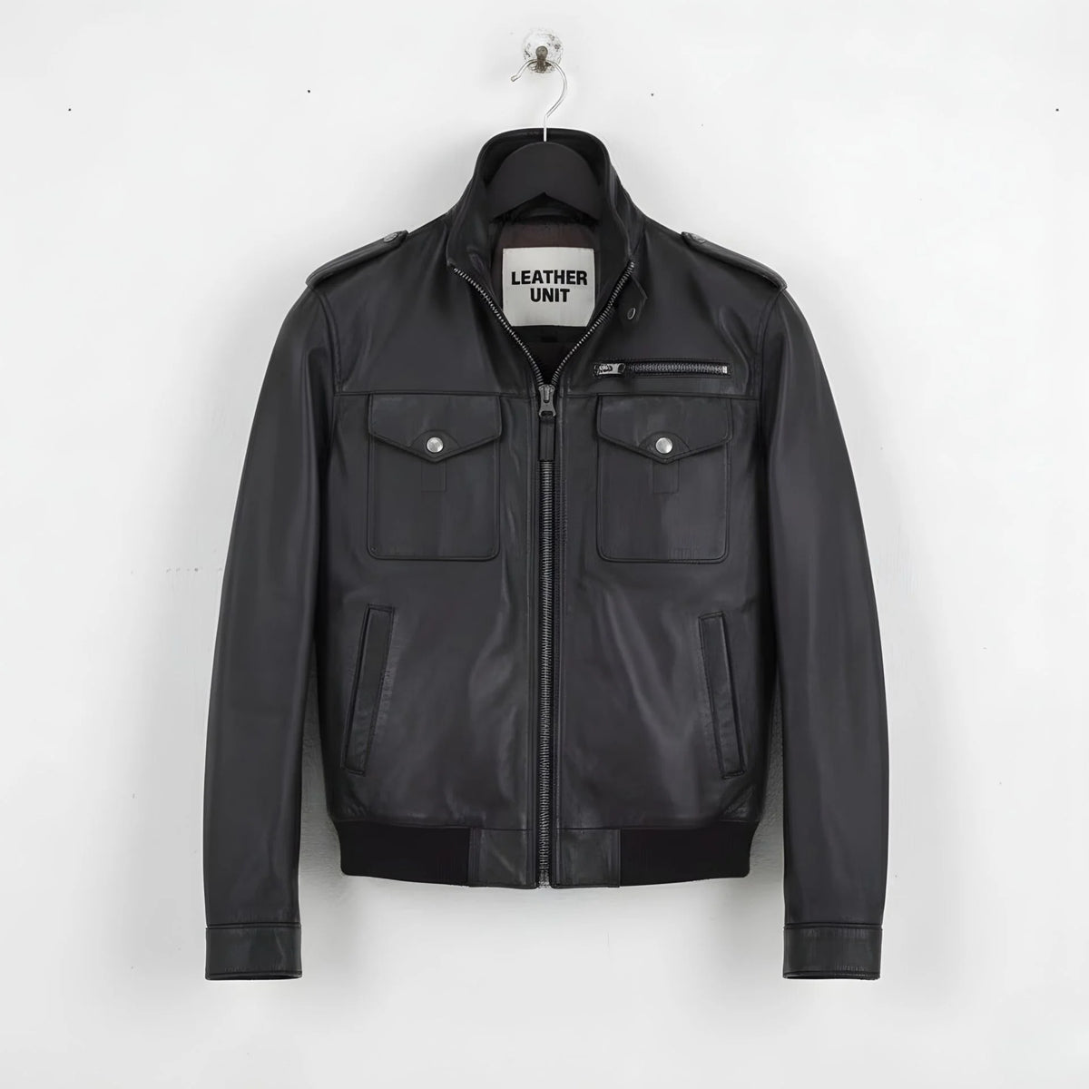 front view of men's black leather field jacket with epaulettes and flap pockets.