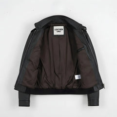 inside of men's black leather field jacket showing brown lining and inner pocket.