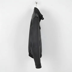 side profile of men's black leather field jacket with band collar.