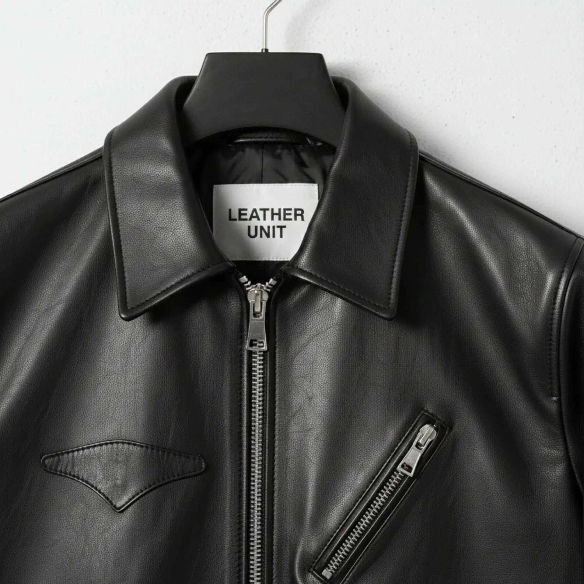 close up of collar and zipper on men's black leather jacket by Leather Unit.
