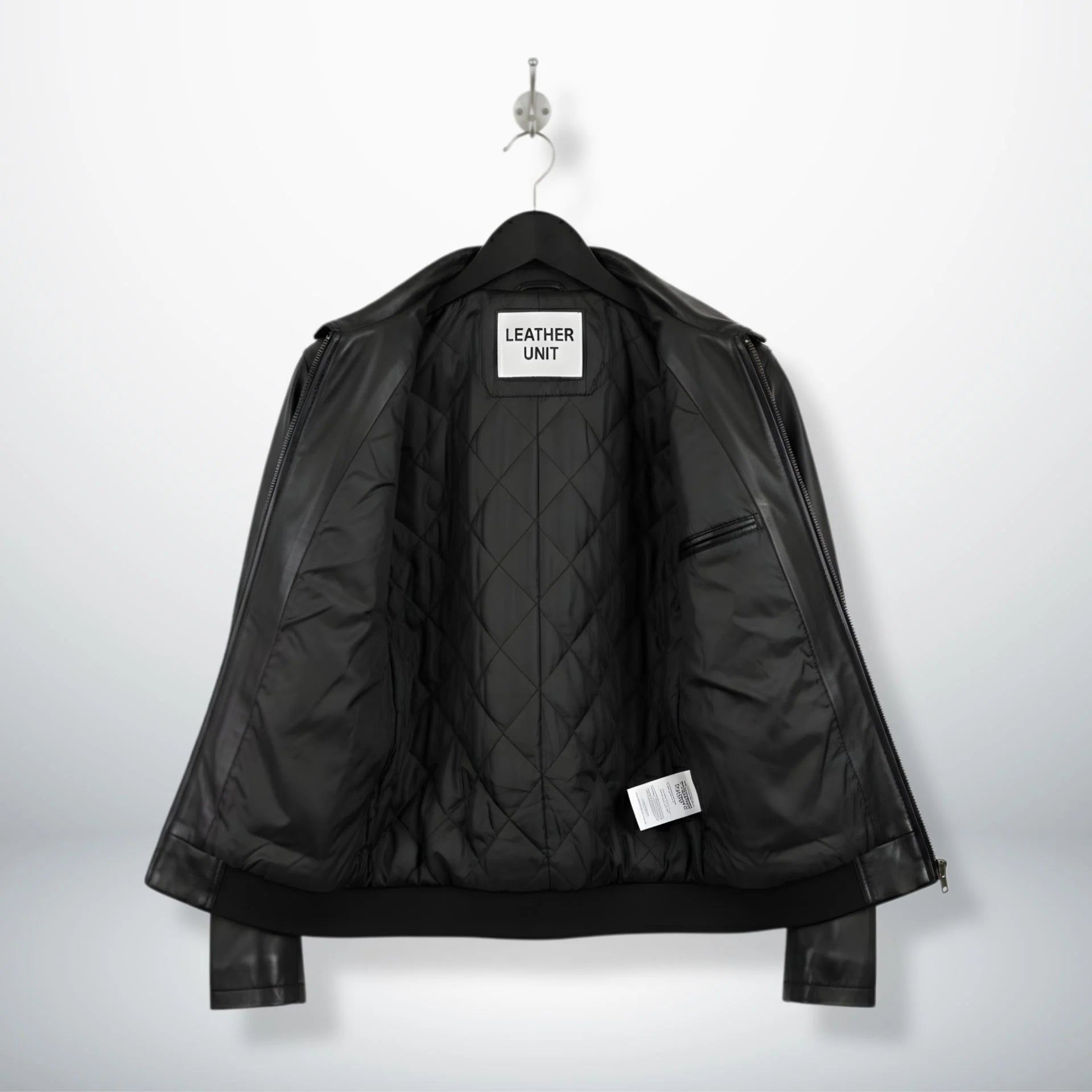 inside view of men's black leather jacket showing quilted lining and inner pocket.