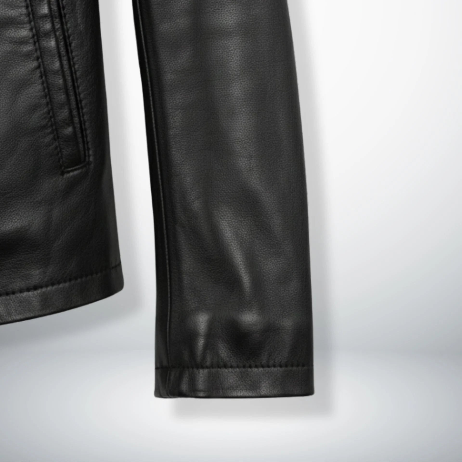 sleeve and cuff detail of men's slim fit black leather jacket.