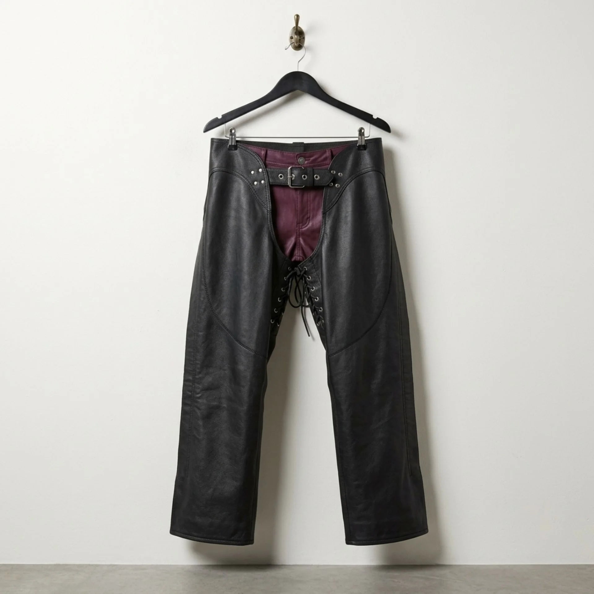 Front view of men's black leather motorcycle chaps with belt and lace front by Leather Unit