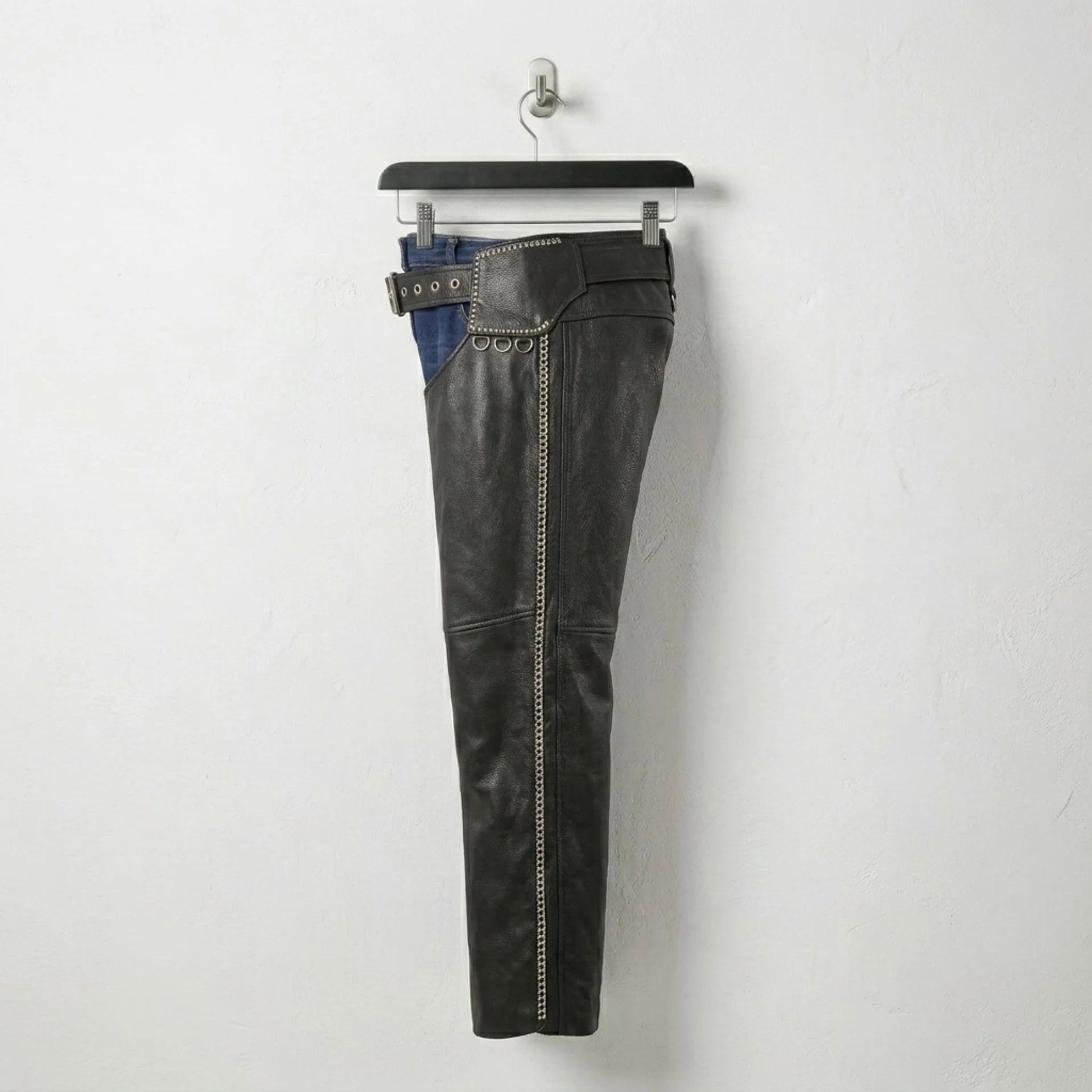 Opposite side view of men's studded black leather motorcycle chaps.