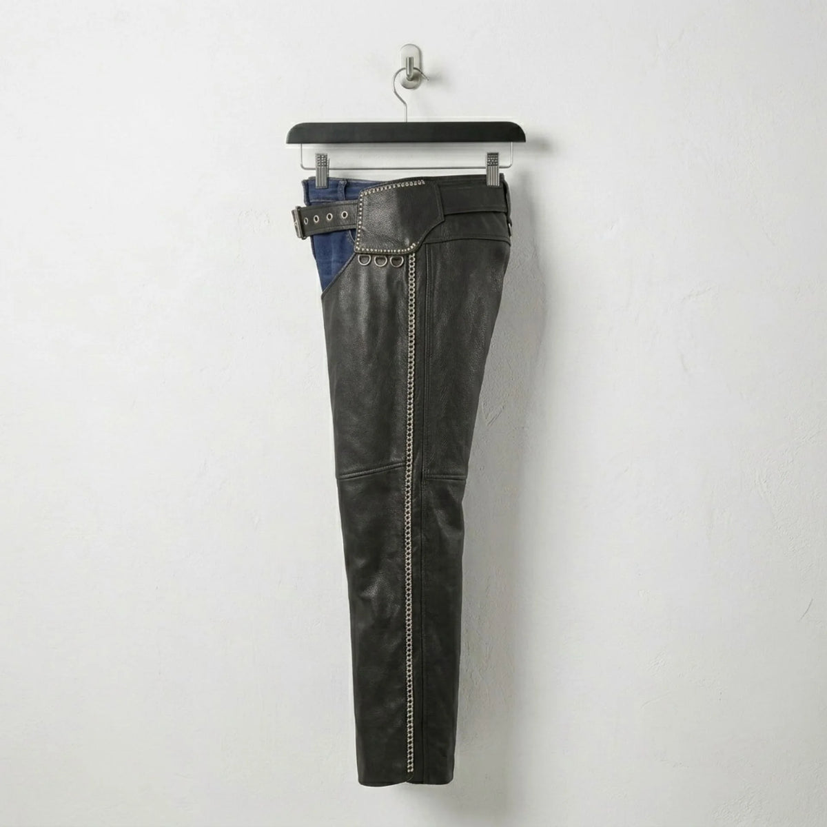 Opposite side view of men's studded black leather motorcycle chaps.
