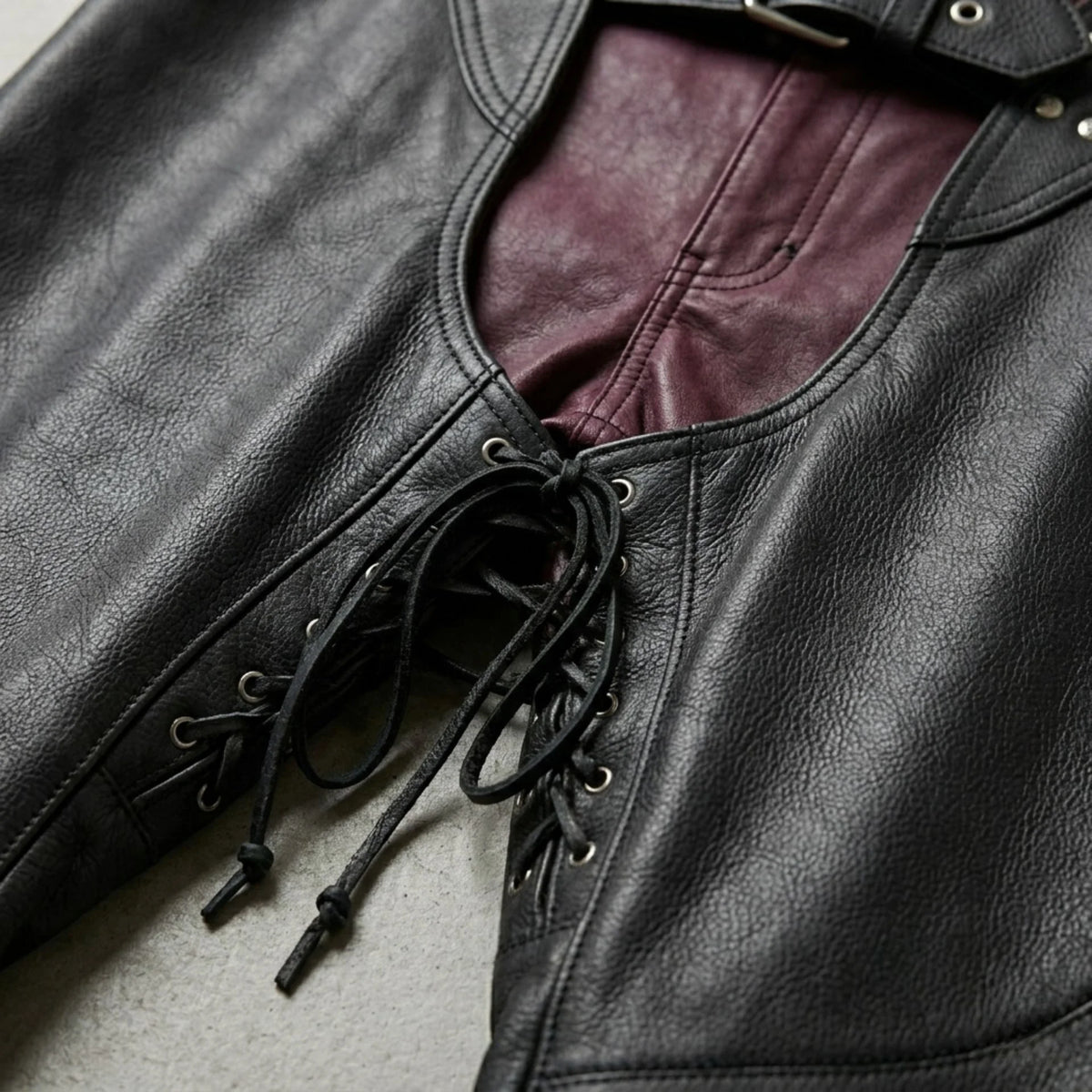 Close-up of lace-up front panel on men's black leather motorcycle chaps