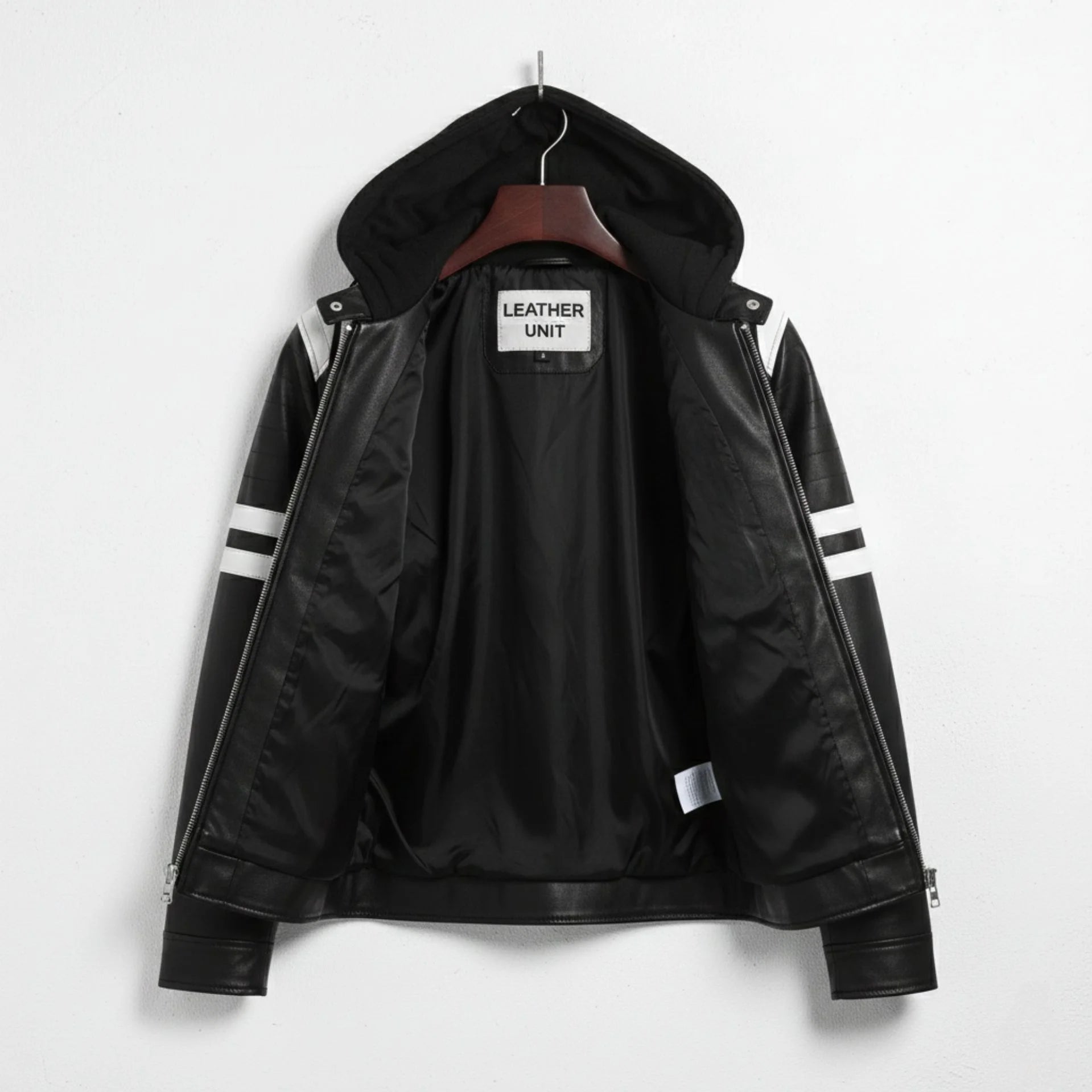 Inside view of men's black hooded moto jacket showing smooth polyester lining.