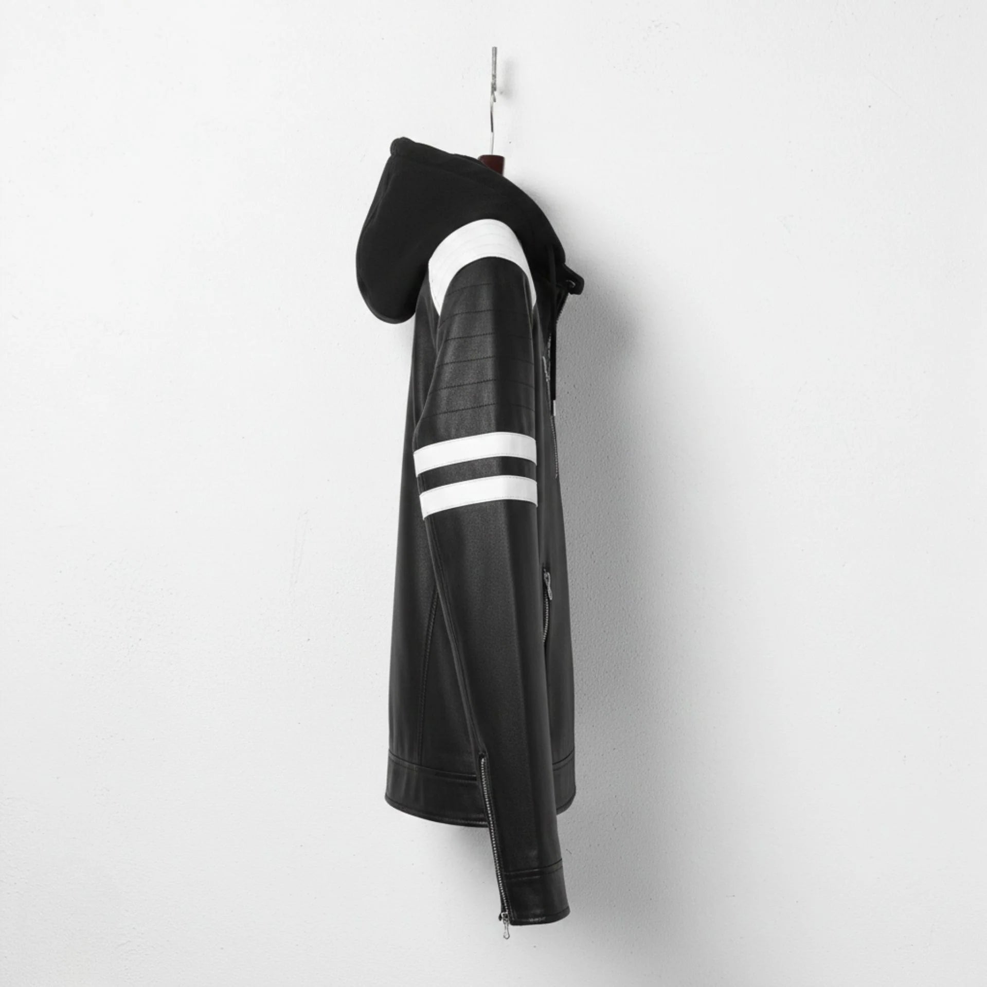 Side profile of men's black leather motorcycle jacket with attached hood and white arm stripes.