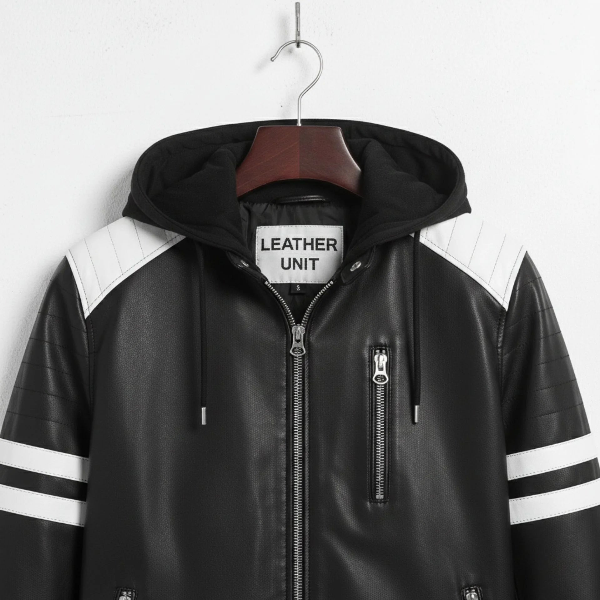 Close‑up of hood and shoulders on men's black leather biker jacket with white quilted panels.