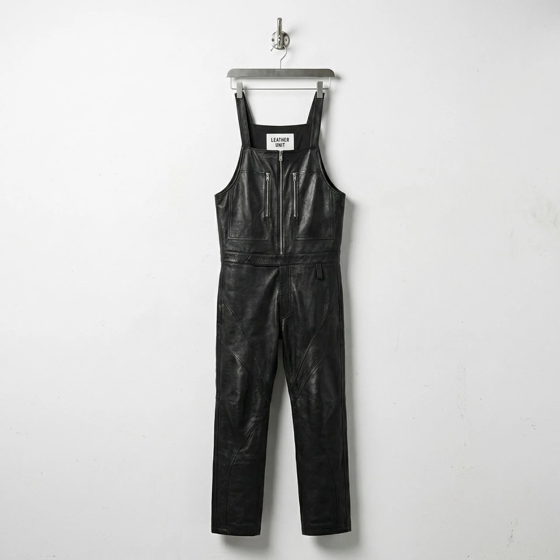 Front view of men's black leather overalls with zip chest pockets by Leather Unit