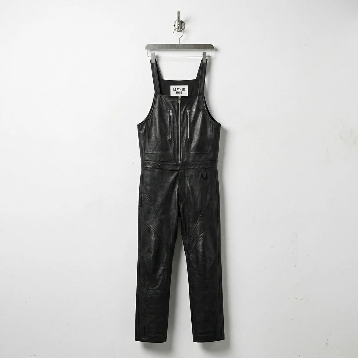 Front view of men's black leather overalls with zip chest pockets by Leather Unit