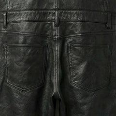 Back pocket and waistband detail on men's black leather overalls