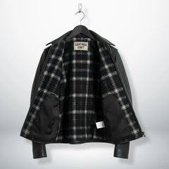 interior of men's black leather rider jacket showing black and white plaid lining.