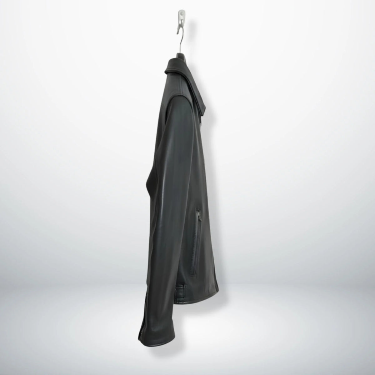 side profile of men's black leather rider jacket with zipper pocket.