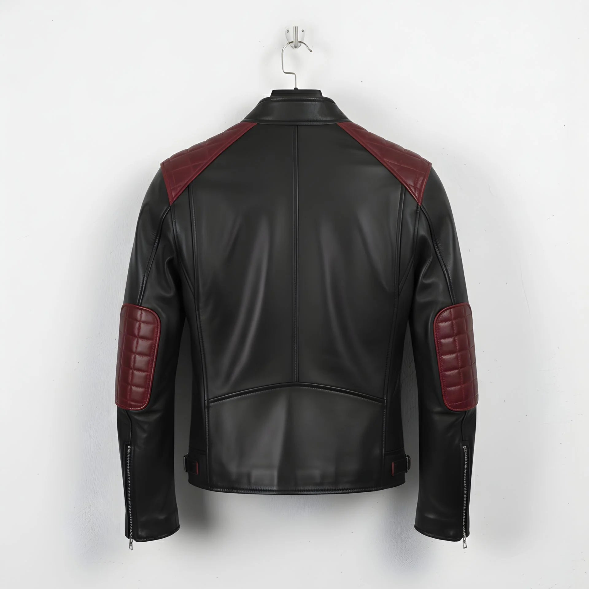 back of men's black and maroon motorcycle leather jacket with quilted elbow patches.