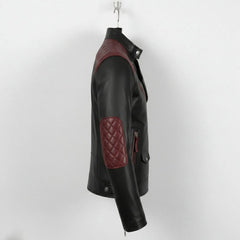 side profile of men's black and maroon leather moto jacket with elbow quilting.