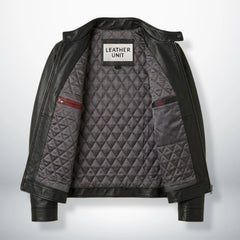 Interior of men's black moto leather jacket showing grey diamond quilted lining and inside pockets.