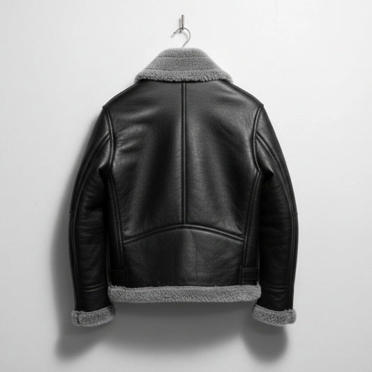 back view mens black leather shearling aviator jacket with grey hem.