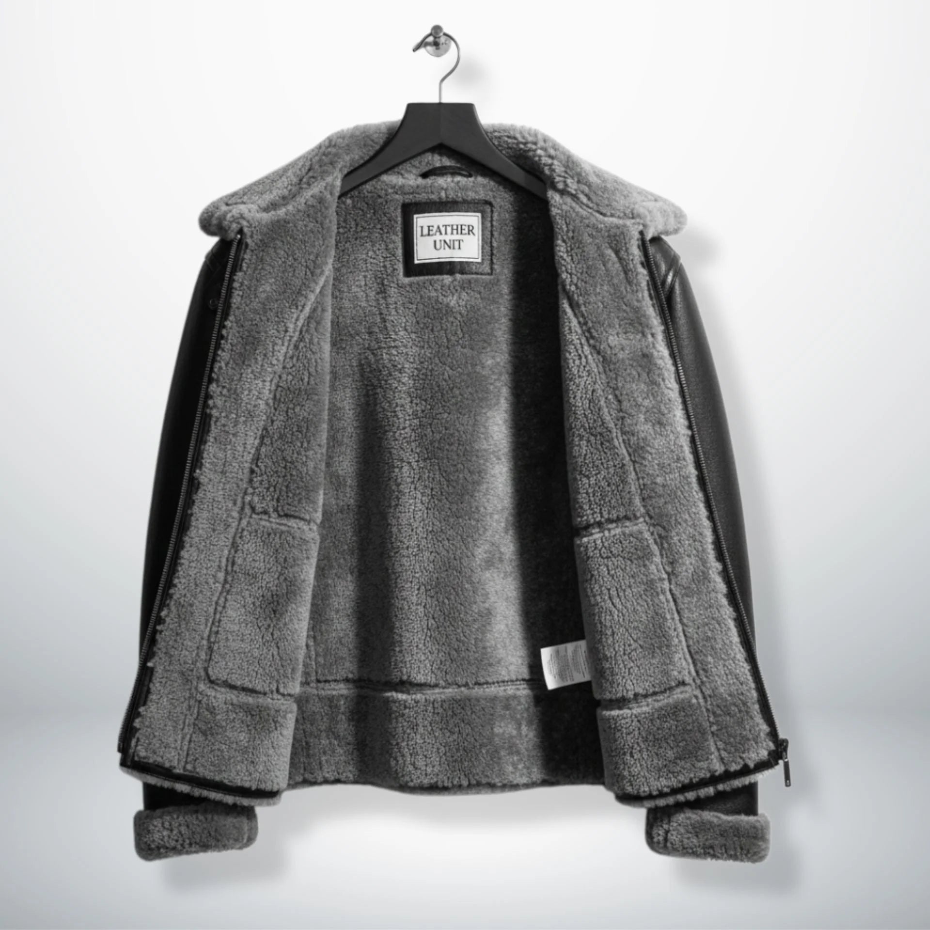 inside view mens black aviator jacket with full grey shearling lining.