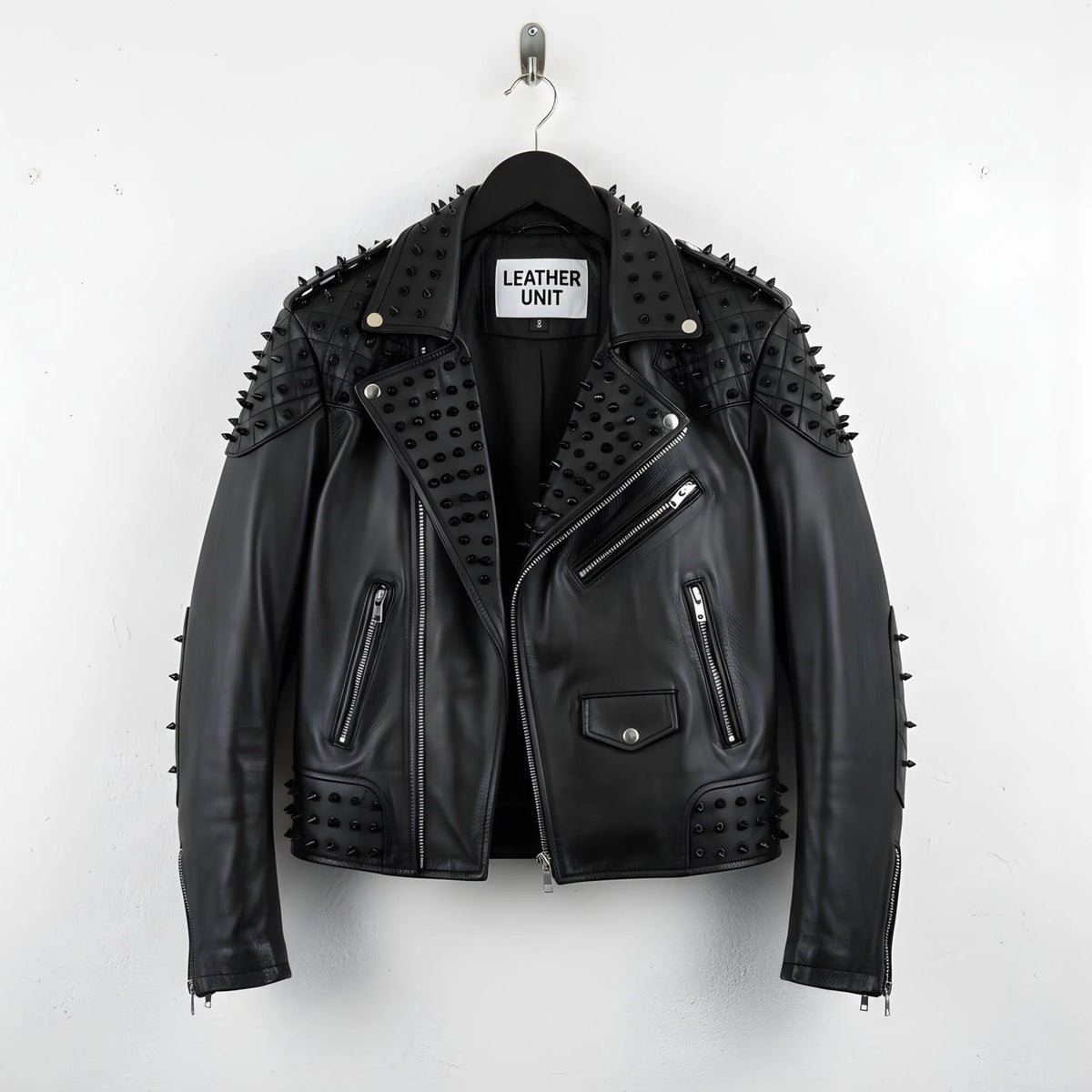 front view of men's black studded leather biker jacket with spikes and zippers.