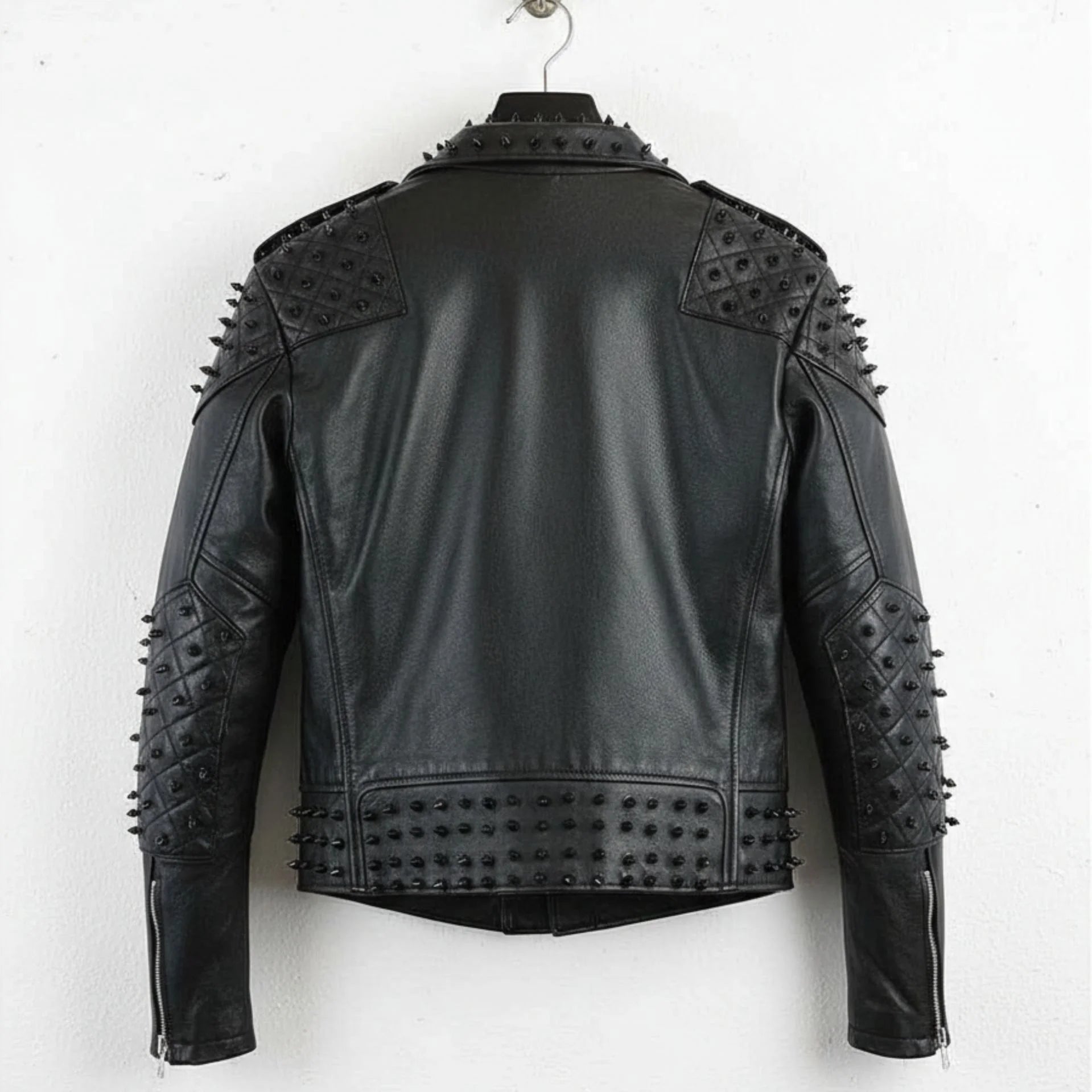 back view of men's black punk studded leather jacket with studded hem and sleeves.