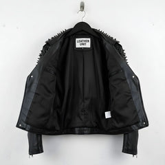 interior of men's black studded biker jacket showing smooth black lining and inner pocket.