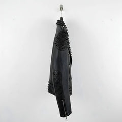 side profile of men's black spike leather jacket with studded elbow panel.