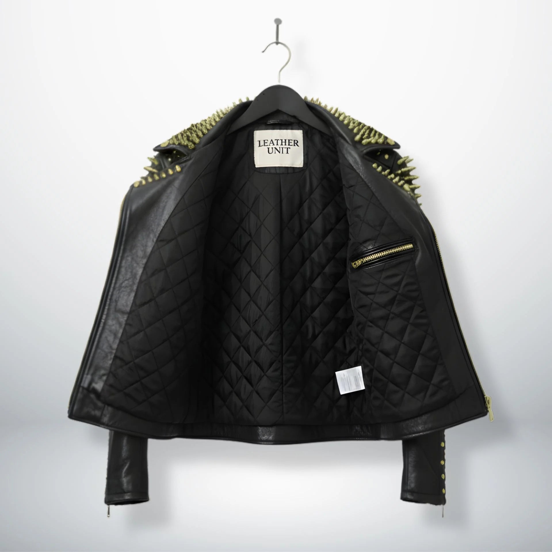 interior of men's studded leather jacket showing black quilted lining.