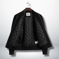 interior view black suede bomber jacket with diamond quilted lining.