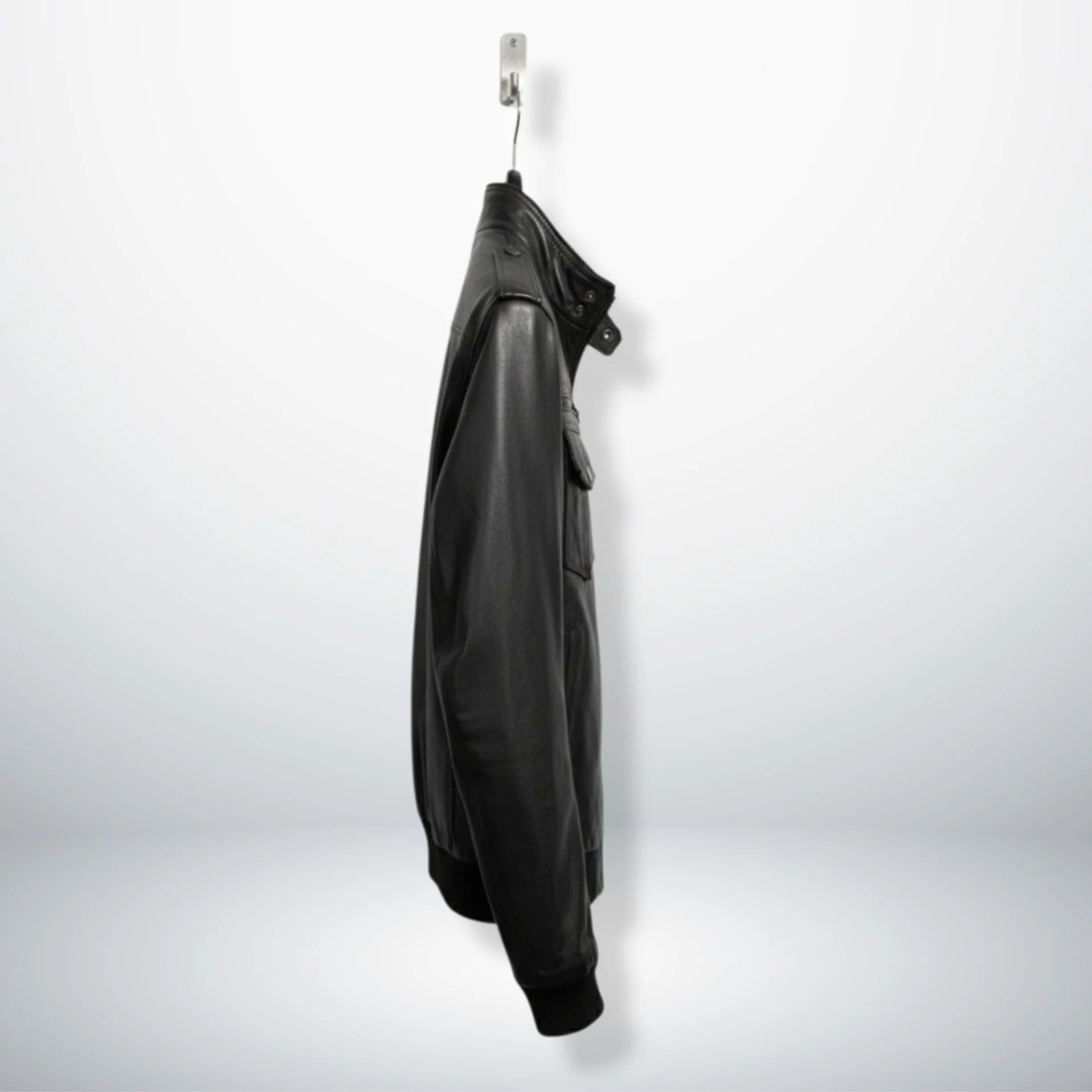 side profile mens black trucker bomber leather jacket hanging.