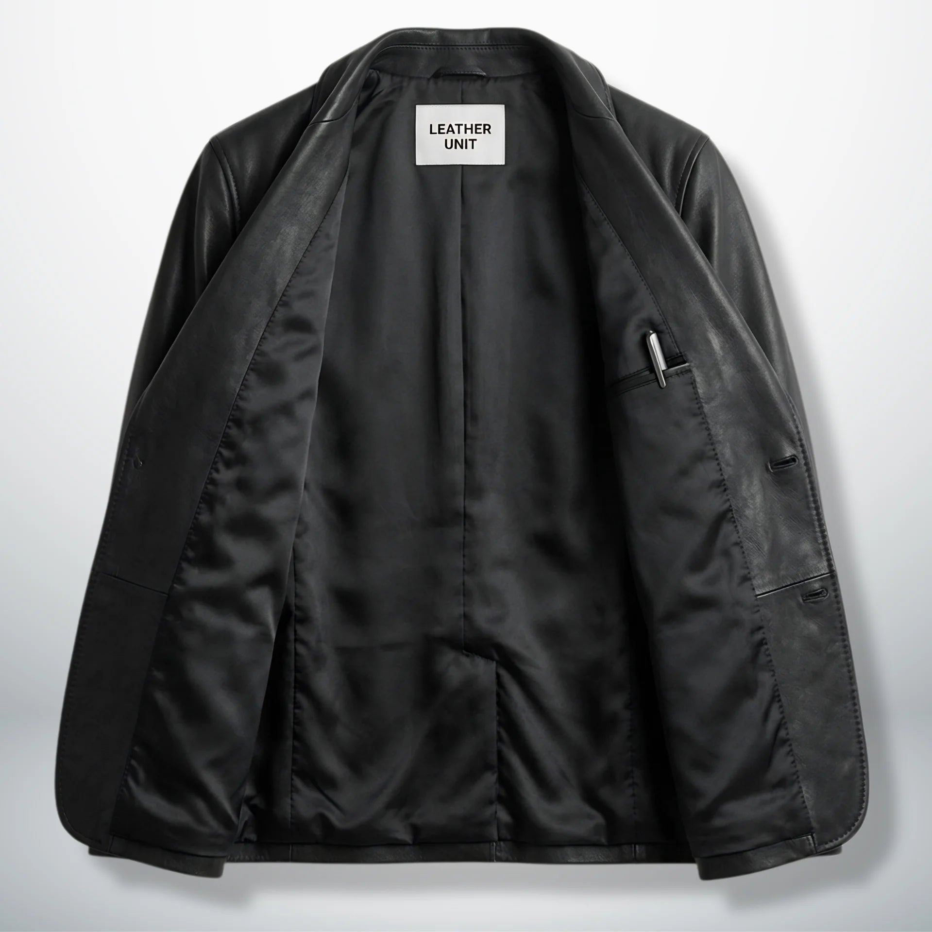 Inside lining of men’s black leather blazer showing interior pockets