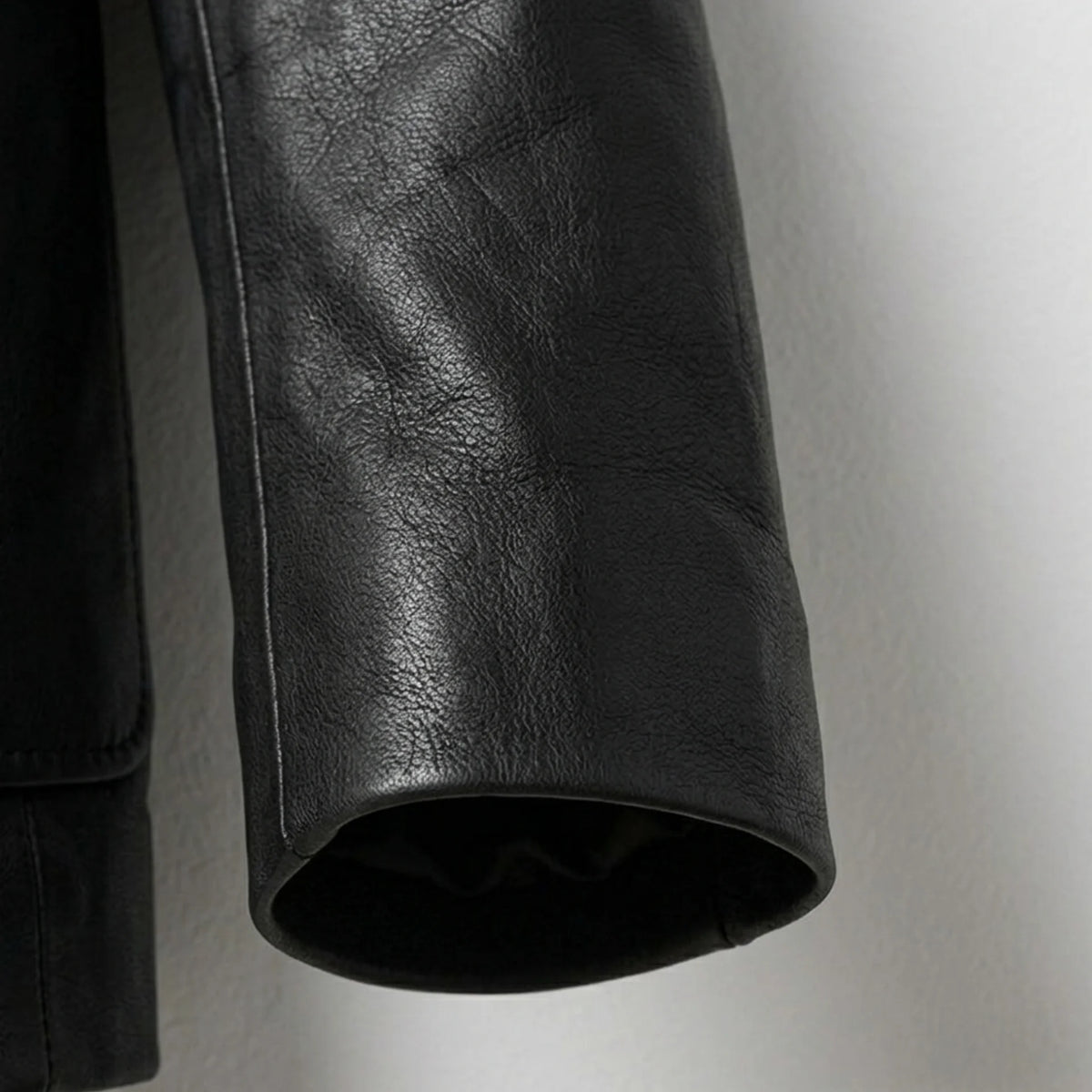 Sleeve detail on men’s black genuine leather blazer jacket