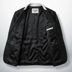 Inside lining of men’s black and white leather blazer showing interior pocket