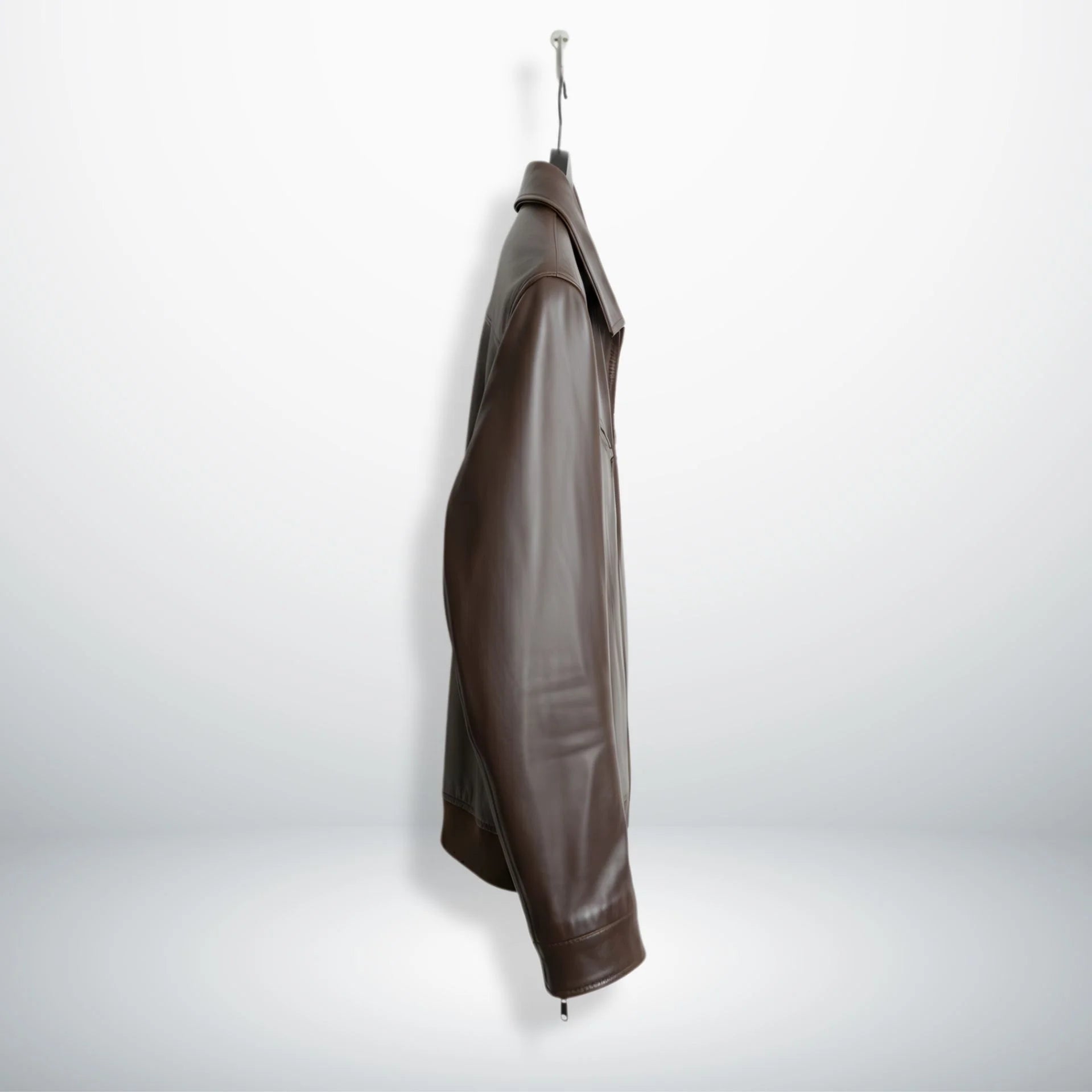 side profile mens brown leather bomber jacket on hanger.