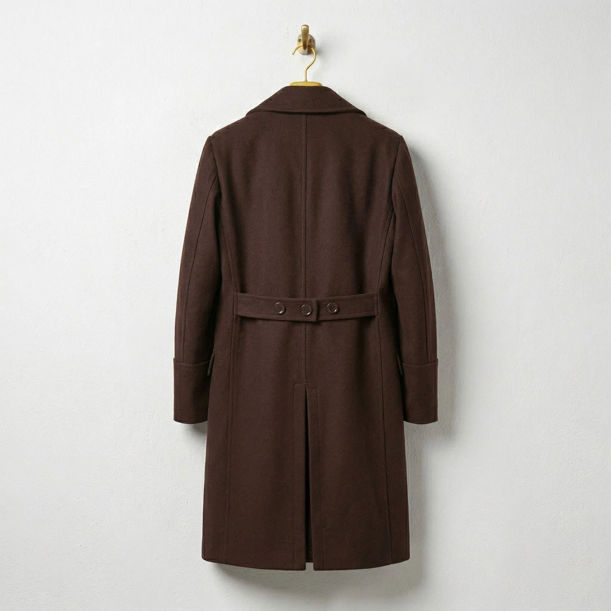 Back view of men's brown wool overcoat with half belt detail.