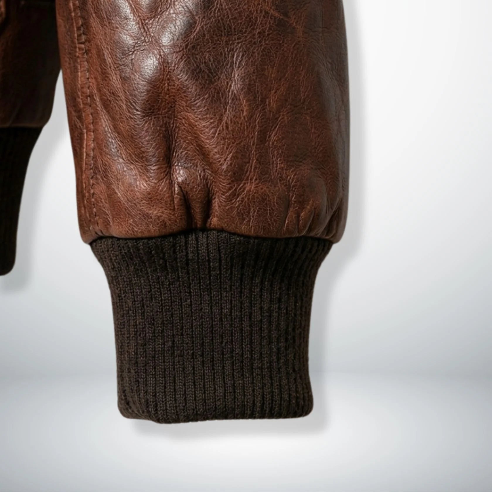 close up ribbed knit cuff on mens brown g1 aviator leather jacket.