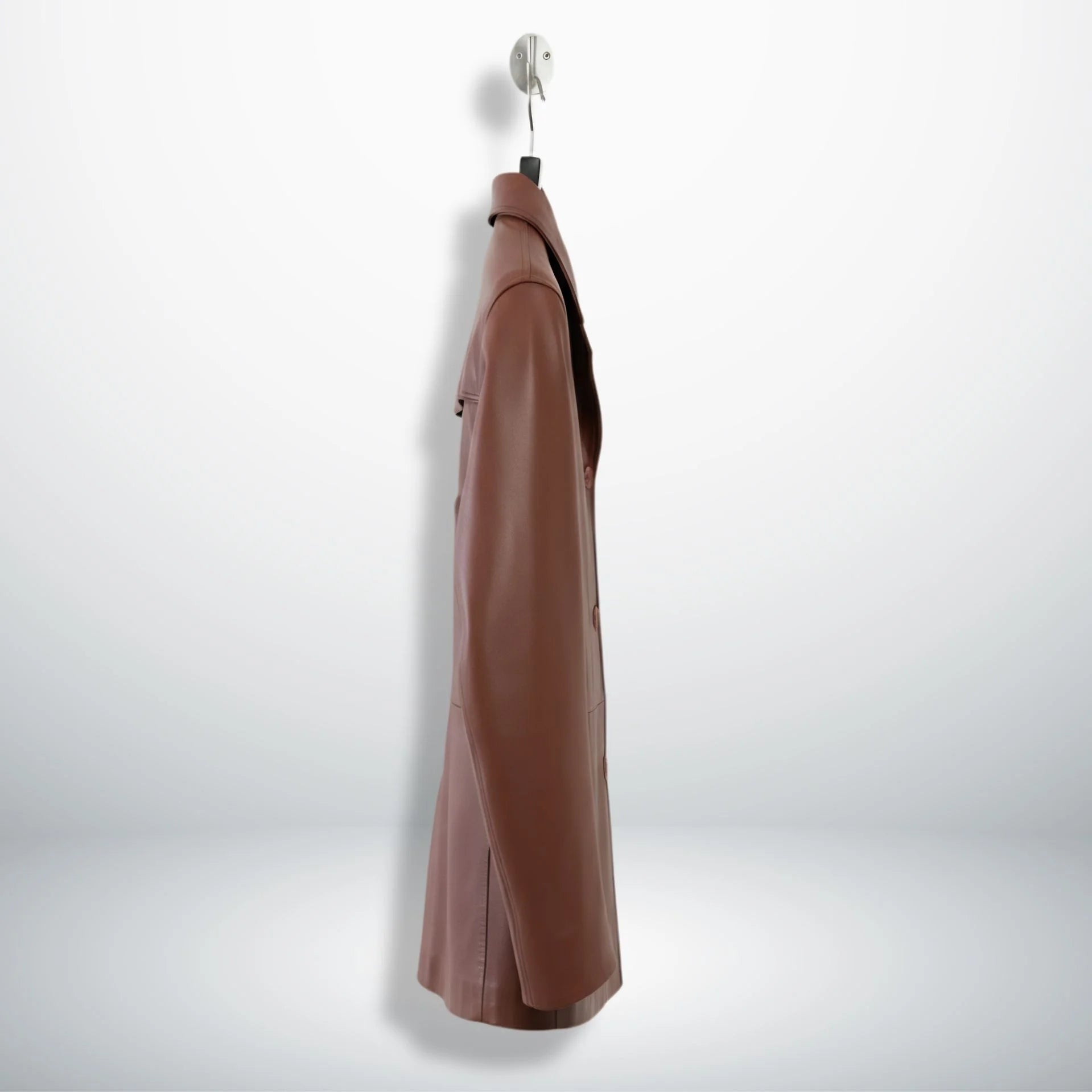Side profile of men’s brown leather blazer coat