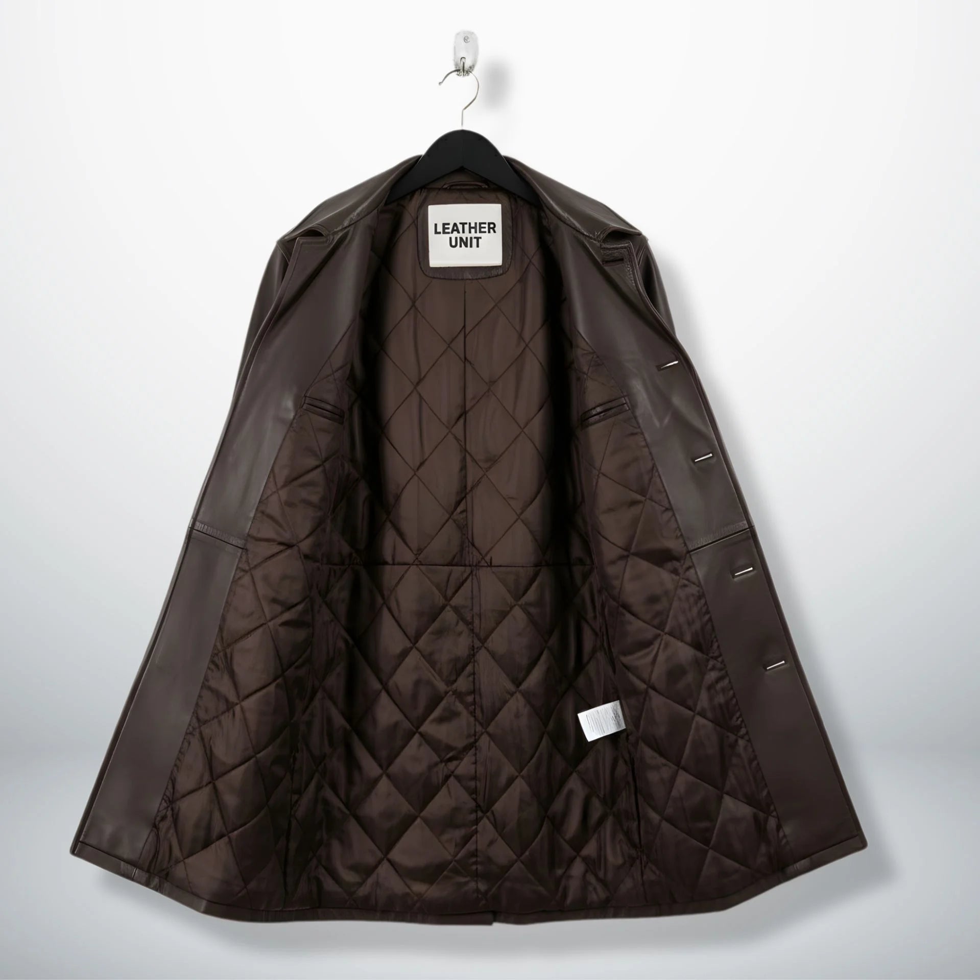Interior of men's brown leather car coat showing diamond quilted lining.